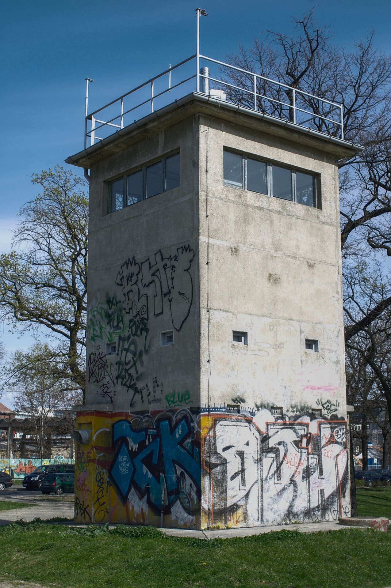 A square concrete former border watchtower with an observation level at the top.