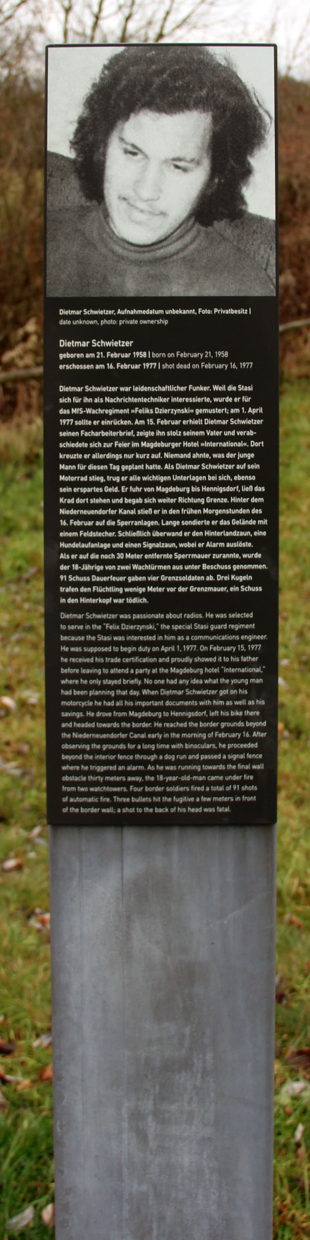 A tall narrow memorial panel with text about Dietmar Schwietzer
