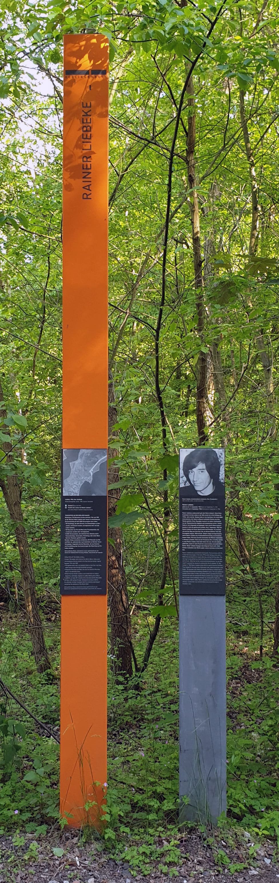 An upright memorial plaque with text commemorating Rainer Liebeke.